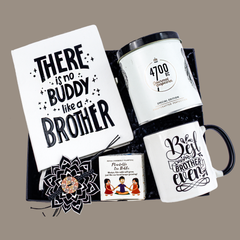 Raksha Bandhan  curated set includes a stylish black and white diary, a sleek pen, delicious popcorn, a cool mug  and a beautifully crafted Rakhi. To add a touch of sustainability, the box also features a seed paper collectible, making it a perfect blend of love, memories, and eco-friendly sentiment