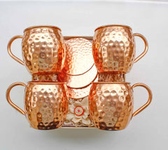 A set of four copper mule mugs and four coasters, presented in a keepsake box with a white background.