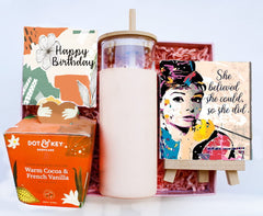 Audrey's Delight" gift box embodies timeless elegance and motivation. Nourish your skin with the moisturizer, sip in style with the bamboo sipper, and be inspired by the wooden desk easel featuring an Audrey Hepburn painting with the empowering quote "She Believed She Could, So She Did." This gift box celebrates the essence of grace, determination, and self-belief, inviting you to embrace your inner strength and pursue your dreams with confidence.