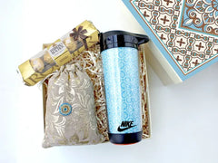 Hamper contains an executive double walled sipper, a mini sweet treat of Ferrero Rocher, and a pouch of premium almonds All in a designer-corrugated gift box I
