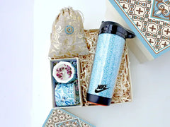 Hamper contains an executive double-walled sipper, a set of handmade soy candles in a designer box, and a pouch of gourmet chocolates 
All in a designer-corrugated gift box