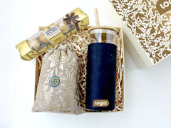 Hamper contains an executive glass sipper with a bamboo top, a  sweet treat of Ferrero Rocher chocolates, and a pouch of organic handmade scented potpourri

All in a designer-corrugated gift box
